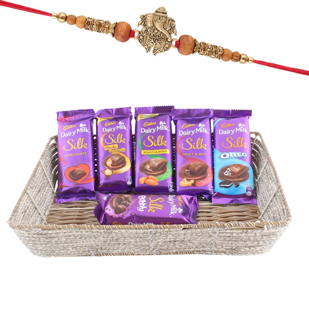 Astonished Retail Flavoured Dairy Milk Chocolate Gift Basket | Premium Rakhi Chocolate for Brother | Designer Ganeshji Rakhi with Chocolates | Roli, Chawal, Chandan, Misri | 384
